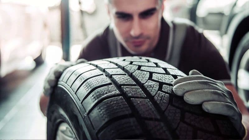 Technicians handling commercial tires at Modern Tire House